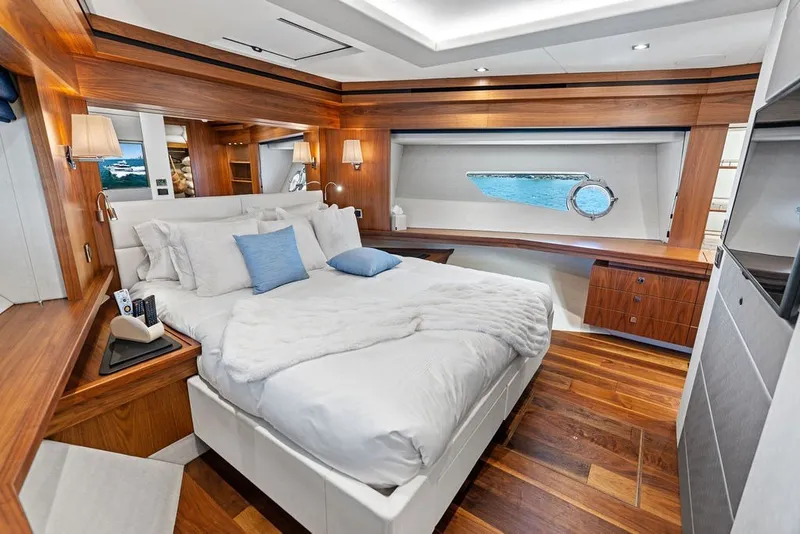 Slide: The Image of Luxurious Sunseeker 86 Yacht 2019 bedroom with elegant wood finishes and ocean view. - 100