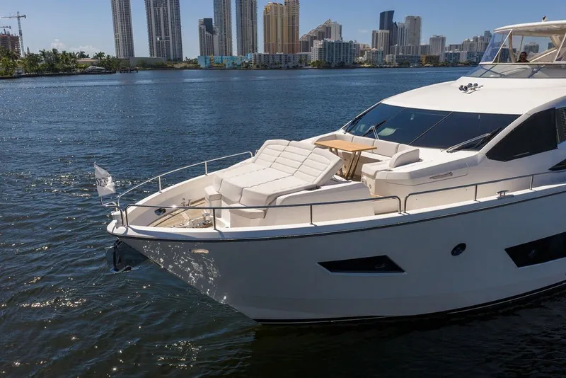 Slide: The Image of Luxurious 2019 Sunseeker 86 Yacht cruising near city skyline on a sunny day. - 9