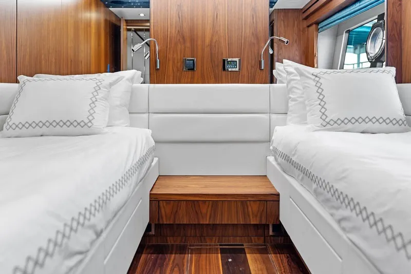 Slide: The Image of Luxurious twin bedroom on 2019 Sunseeker 86 Yacht with elegant wood accents. - 88