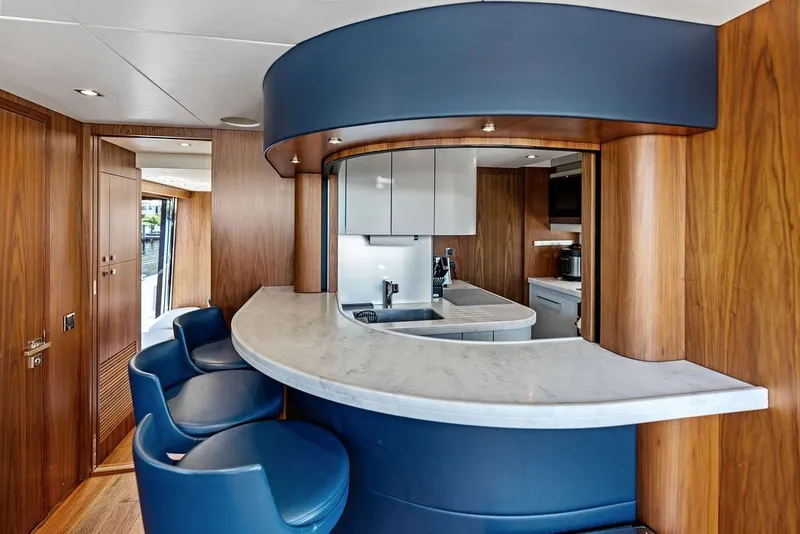 Slide: The Image of Luxurious interior of 2019 Sunseeker 86 Yacht with modern kitchen and seating area. - 112