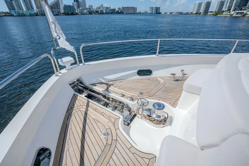 Slide: The Image of Luxurious 2019 Sunseeker 86 Yacht deck with scenic waterfront city view. - 30