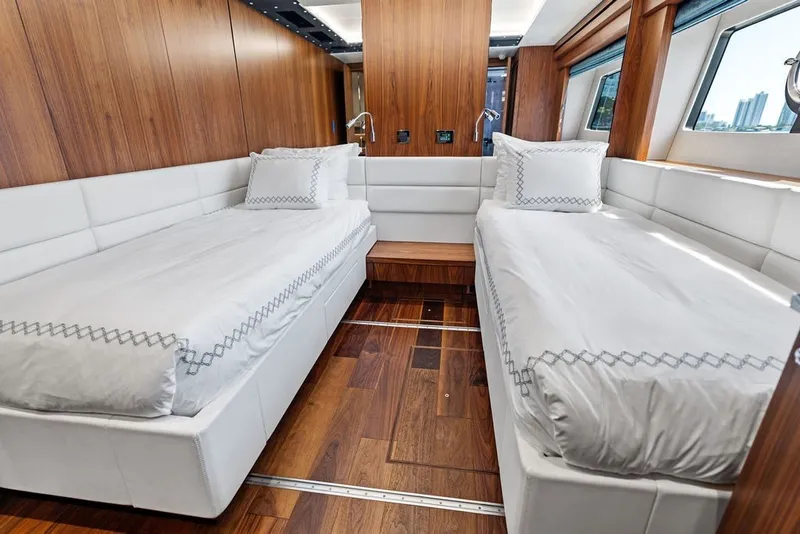 Slide: The Image of Luxurious twin cabin interior on 2019 Sunseeker 86 Yacht with elegant wood paneling. - 84
