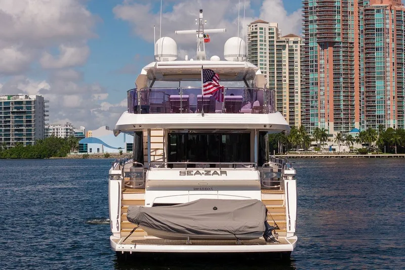 Slide: The Image of Sunseeker 86 Yacht 2019 docked with city skyline in background. - 5