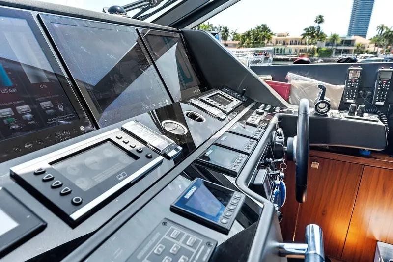 Slide: The Image of Control panel of a 2019 Sunseeker 86 Yacht, featuring advanced navigation systems. - 120