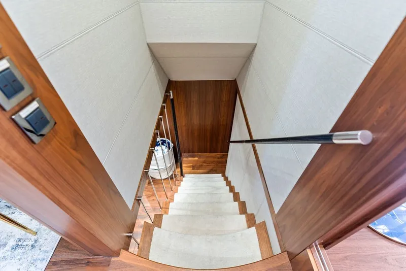 Slide: The Image of Staircase with wooden finish inside 2019 Sunseeker 86 Yacht, featuring modern design elements. - 71