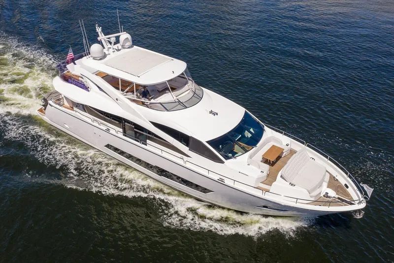 Slide: The Image of Luxurious 2019 Sunseeker 86 Yacht cruising on open water, showcasing sleek design and elegance. - 24