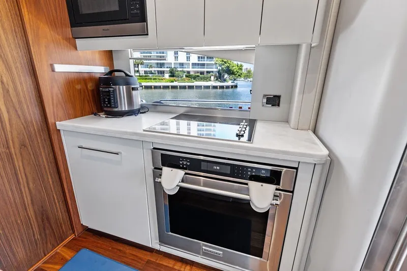 Slide: The Image of Modern kitchen in 2019 Sunseeker 86 Yacht with sleek appliances and waterfront view. - 126