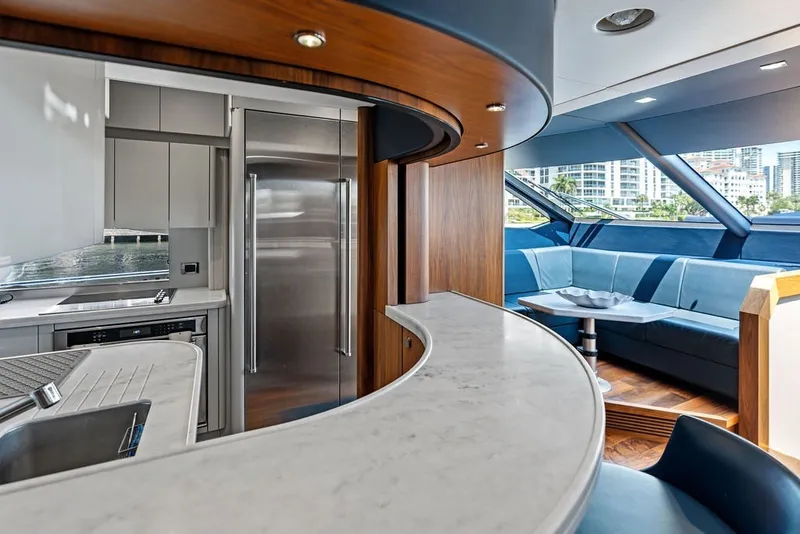 Slide: The Image of Luxurious interior of 2019 Sunseeker 86 Yacht featuring modern kitchen and elegant seating area. - 113