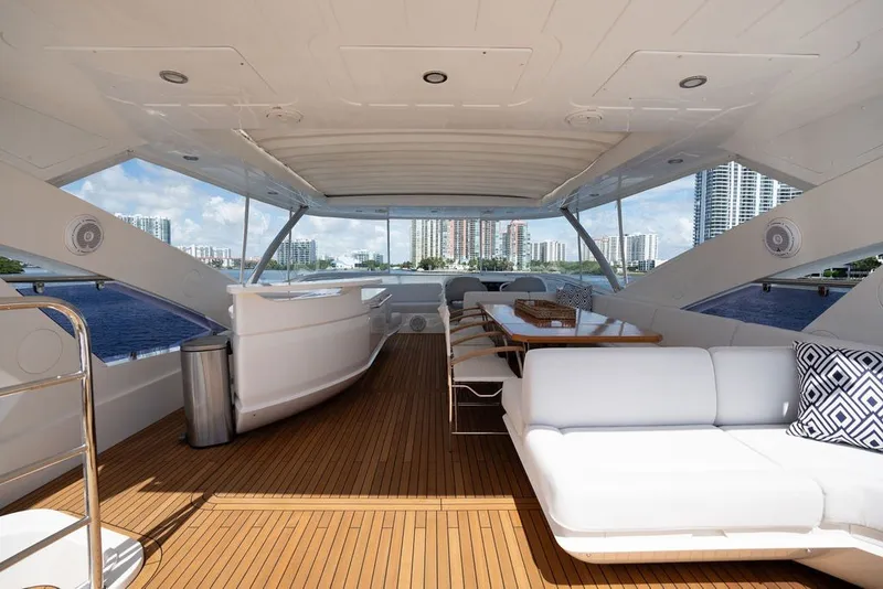 Slide: The Image of Luxurious Sunseeker 86 Yacht 2019 with spacious deck, modern seating, and scenic waterfront views. - 49