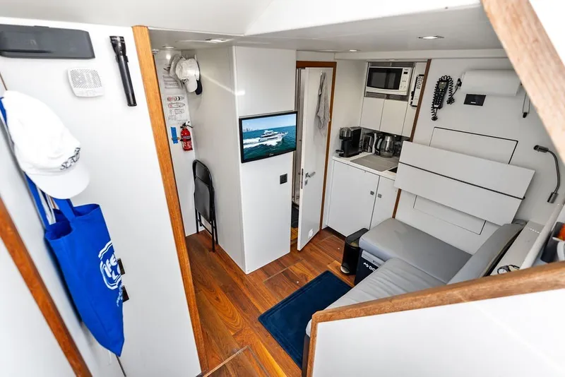 Slide: The Image of Interior of 2019 Sunseeker 86 Yacht with modern amenities and wooden flooring. - 132