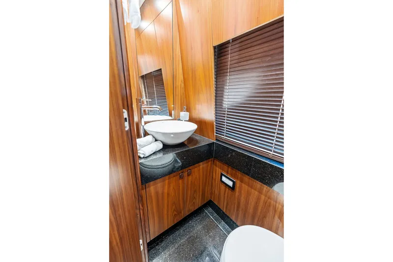 Slide: The Image of Luxurious bathroom interior on 2019 Sunseeker 86 Yacht with wood paneling and modern fixtures. - 130