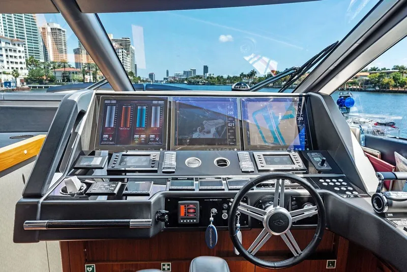 Slide: The Image of Cockpit of 2019 Sunseeker 86 Yacht with advanced navigation systems and steering wheel. - 119