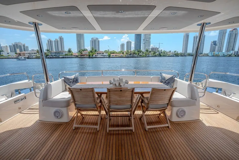 Slide: The Image of Luxurious Sunseeker 86 Yacht 2019 with elegant deck dining area and stunning waterfront view. - 39