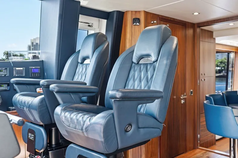 Slide: The Image of Luxurious interior of 2019 Sunseeker 86 Yacht with plush blue captain chairs. - 117