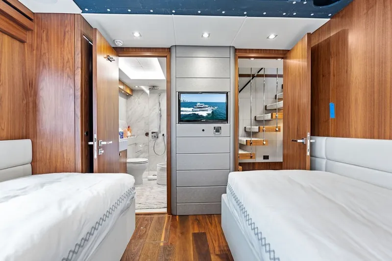 Slide: The Image of Luxurious interior of 2019 Sunseeker 86 Yacht with twin beds and modern bathroom. - 93