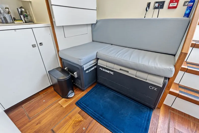 Slide: The Image of Interior of 2019 Sunseeker 86 Yacht with seating and Dometic cooler. - 134