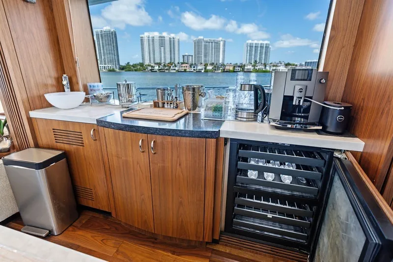 Slide: The Image of Luxurious kitchen area on a 2019 Sunseeker 86 Yacht with modern appliances and waterfront view. - 106