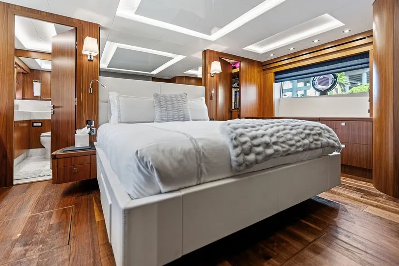 Slide: The Image of Luxurious bedroom interior of 2019 Sunseeker 86 Yacht with elegant wood finishes. - 73