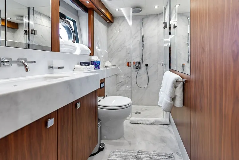 Slide: The Image of Luxurious bathroom on 2019 Sunseeker 86 Yacht with marble and wood finishes. - 85