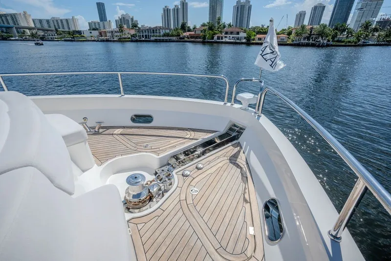 Slide: The Image of Luxurious 2019 Sunseeker 86 Yacht deck with city skyline and waterfront views. - 31