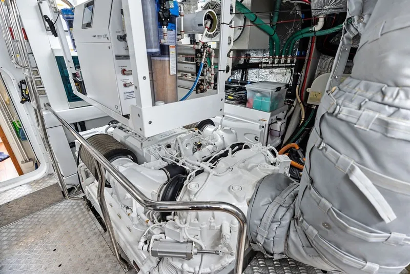 Slide: The Image of Engine room of a 2019 Sunseeker 86 Yacht, showcasing mechanical components and equipment. - 141