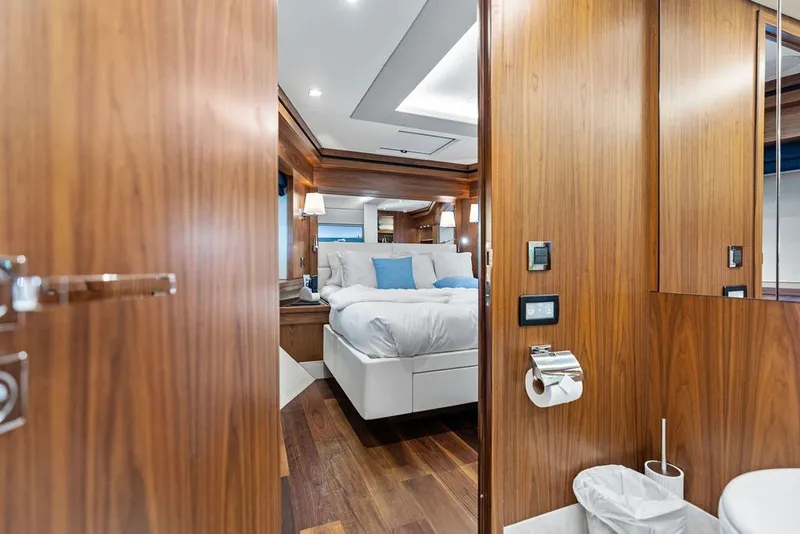 Slide: The Image of Luxurious interior of 2019 Sunseeker 86 Yacht with elegant wood paneling and cozy bedroom. - 104