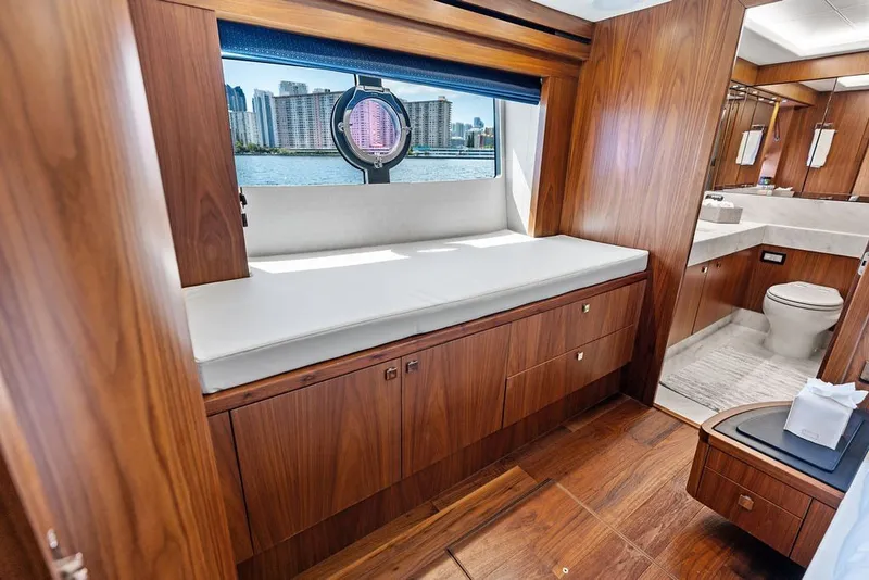 Slide: The Image of Luxurious interior of 2019 Sunseeker 86 Yacht with wood finish and waterfront view. - 82
