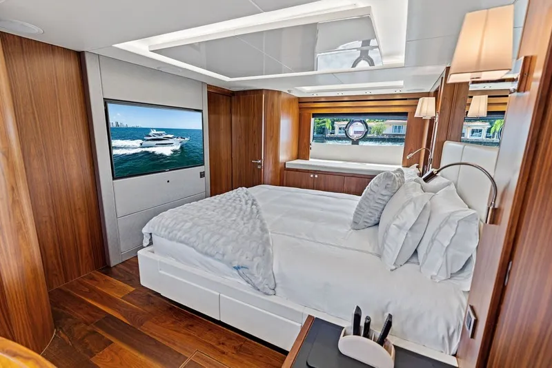 Slide: The Image of Luxurious bedroom interior of 2019 Sunseeker 86 Yacht with elegant wood finishes and modern amenities. - 77