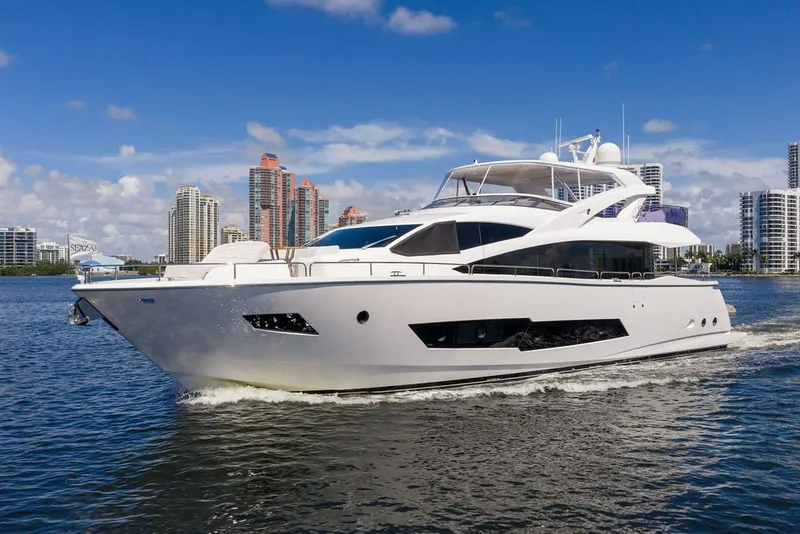 Slide: The Image of Luxurious 2019 Sunseeker 86 Yacht cruising near city skyline on a sunny day. - 15