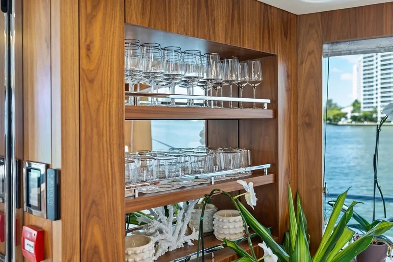 Slide: The Image of Luxurious interior of 2019 Sunseeker 86 Yacht with elegant glassware display. - 107