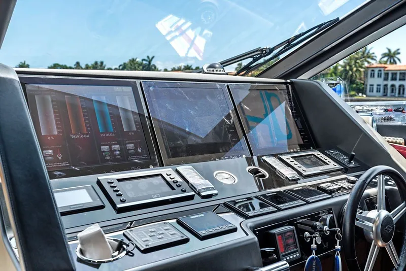 Slide: The Image of Cockpit of 2019 Sunseeker 86 Yacht with advanced navigation controls and displays. - 118