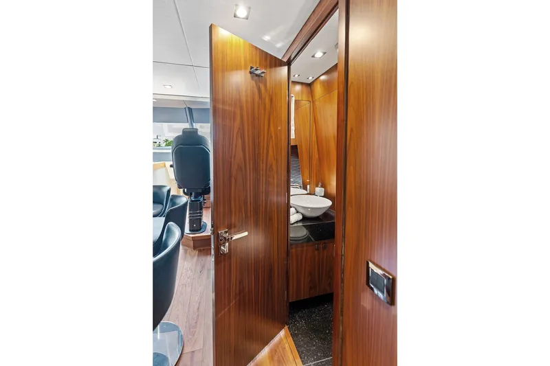 Slide: The Image of Luxurious interior of 2019 Sunseeker 86 Yacht featuring elegant wood finishes and modern amenities. - 129