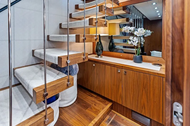 Slide: The Image of Luxurious interior of 2019 Sunseeker 86 Yacht with elegant wooden staircase and modern decor. - 83
