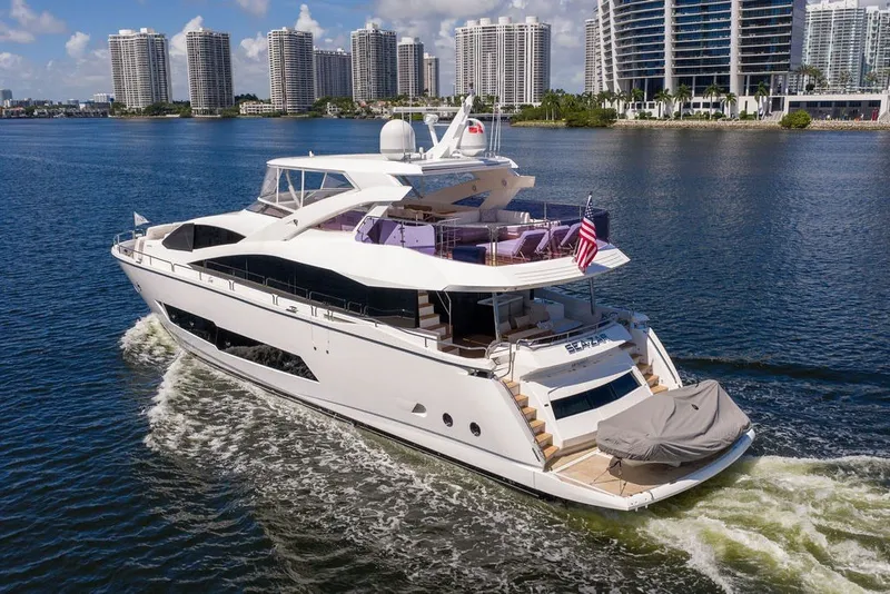 Slide: The Image of Luxurious 2019 Sunseeker 86 Yacht cruising near modern city skyline. - 18
