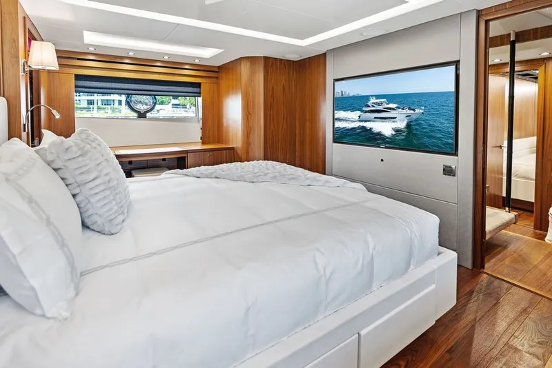Slide: The Image of Luxurious bedroom interior of 2019 Sunseeker 86 Yacht with elegant wood finishes. - 74
