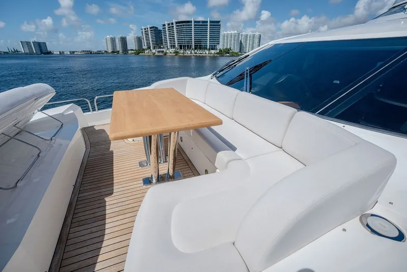 Slide: The Image of Luxurious Sunseeker 86 Yacht 2019 with elegant deck seating and scenic waterfront view. - 34