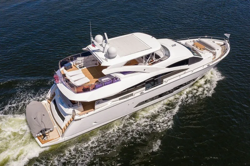 Slide: The Image of Luxurious 2019 Sunseeker 86 Yacht cruising on open water, showcasing sleek design and spacious decks. - 23