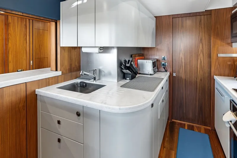 Slide: The Image of Modern kitchen interior on 2019 Sunseeker 86 Yacht with sleek cabinetry and appliances. - 123