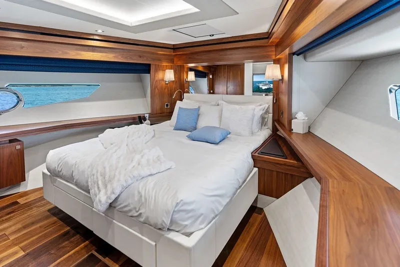 Slide: The Image of Luxurious bedroom interior of 2019 Sunseeker 86 Yacht with elegant wood finishes and ocean view. - 99