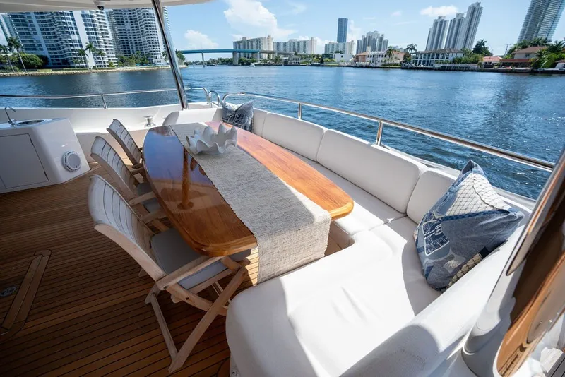 Slide: The Image of Luxurious Sunseeker 86 Yacht 2019 deck with elegant dining area and waterfront view. - 37
