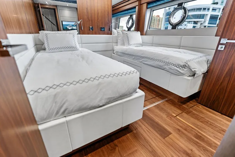Slide: The Image of Luxurious twin bedroom on 2019 Sunseeker 86 Yacht with elegant wood finishes. - 89