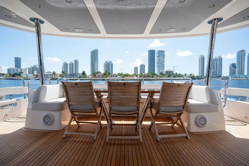 Slide: The Image of Luxurious Sunseeker 86 Yacht deck with city skyline view, 2019 model. - 40