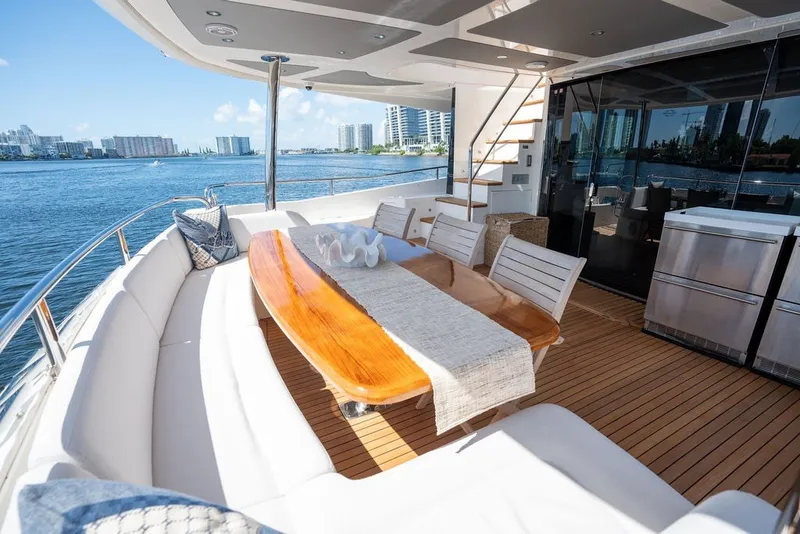 Slide: The Image of Luxurious Sunseeker 86 Yacht 2019 with elegant outdoor dining area and scenic waterfront view. - 41