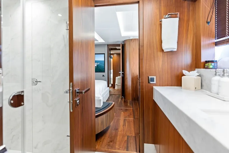 Slide: The Image of Luxurious interior of 2019 Sunseeker 86 Yacht featuring elegant wood finishes and modern amenities. - 81