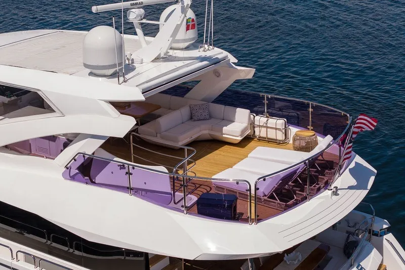 Slide: The Image of Luxurious 2019 Sunseeker 86 Yacht with spacious deck and elegant seating area on the water. - 10