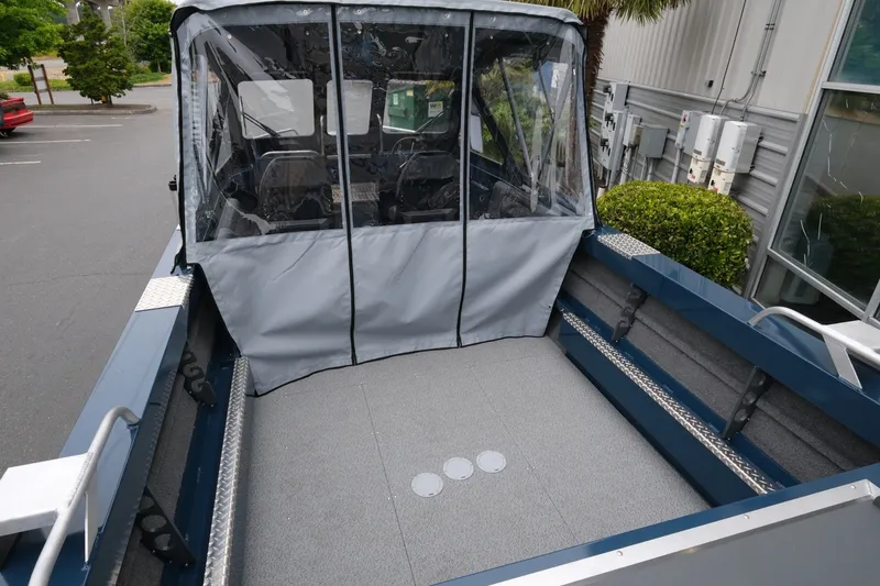 Slide: The Image of 2023 Hewescraft 200 ProV ET boat with covered cockpit, parked outdoors. - 7