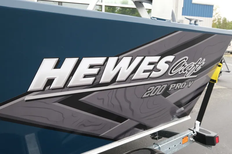 Slide: The Image of 2023 Hewescraft 200 ProV ET boat with bold branding on the side. - 6