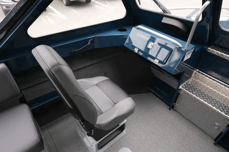 Slide: The Image of Interior of 2023 Hewescraft 200 ProV ET boat, featuring a comfortable seat and storage area. - 14