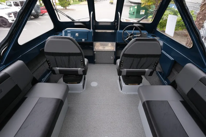 Slide: The Image of Interior of 2023 Hewescraft 200 ProV ET boat with seating and steering wheel. - 9