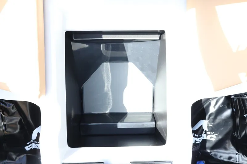 Slide: The Image of Close-up of a black storage compartment on a boat, surrounded by white and black surfaces. - 30